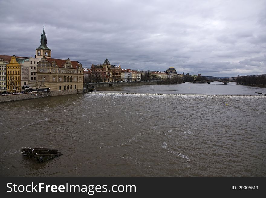 View of the river and old buildings, vltava in prague in cloudy day