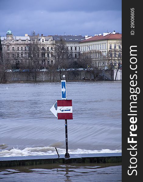 Shipping label on the flooded river vltava in prague