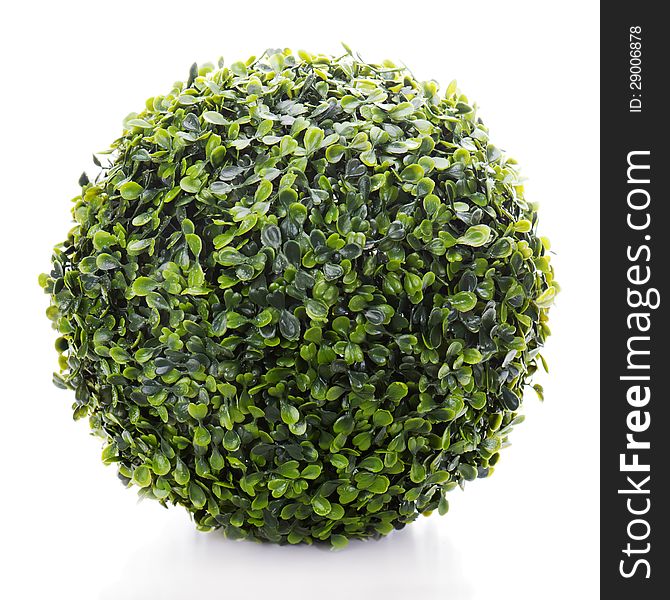 Sphere from green artificial grass on white background