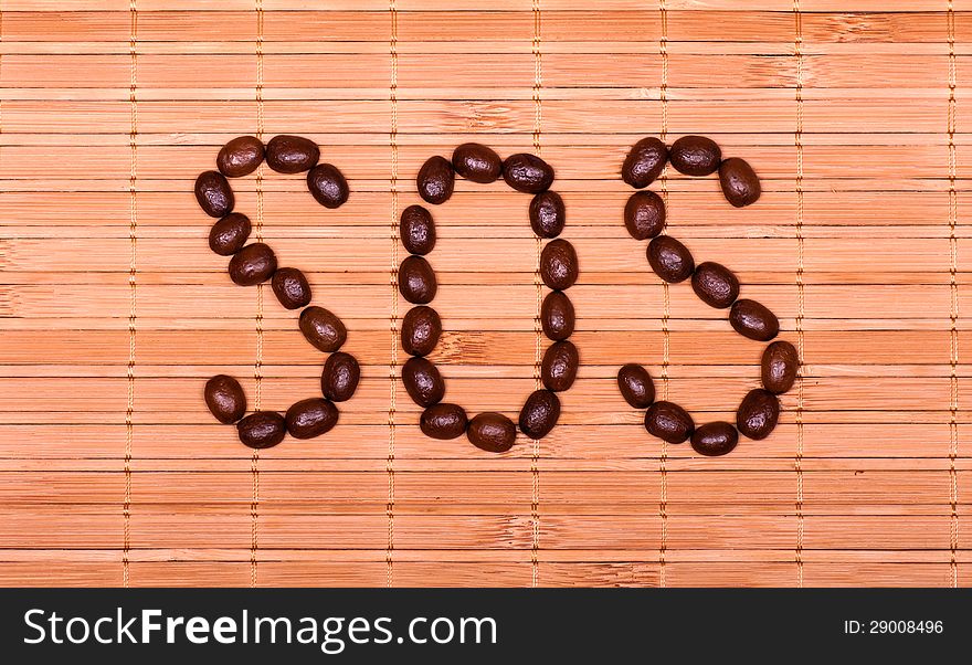 SOS symbol of the grains of coffee on a decorative straw. SOS symbol of the grains of coffee on a decorative straw