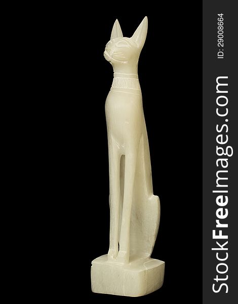 Statuette of the Egyptian god with the appearance of a cat. Made of jade (nephrite). Black background. Statuette of the Egyptian god with the appearance of a cat. Made of jade (nephrite). Black background.