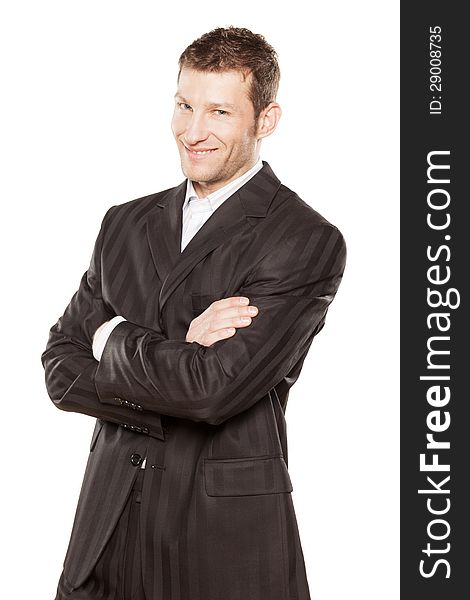 Portrait of a businessman with arms crossed on white background