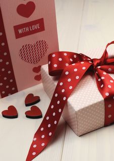 Love Theme Ft Card With Pink Gift And Red Polka Dot Ribbon And Hearts. Vertical. Stock Photography Love Theme Ft Card With Pink Gift And Red Polka Dot Ribbon And Hearts. Vertical. Stock Photography