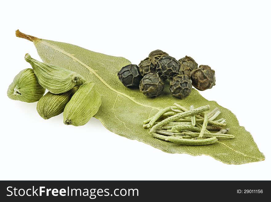 Bay leaf with pepper cardamom and coriander on white background