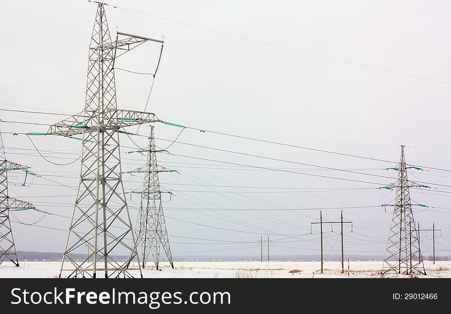 High Voltage Tower  On A Winter Background