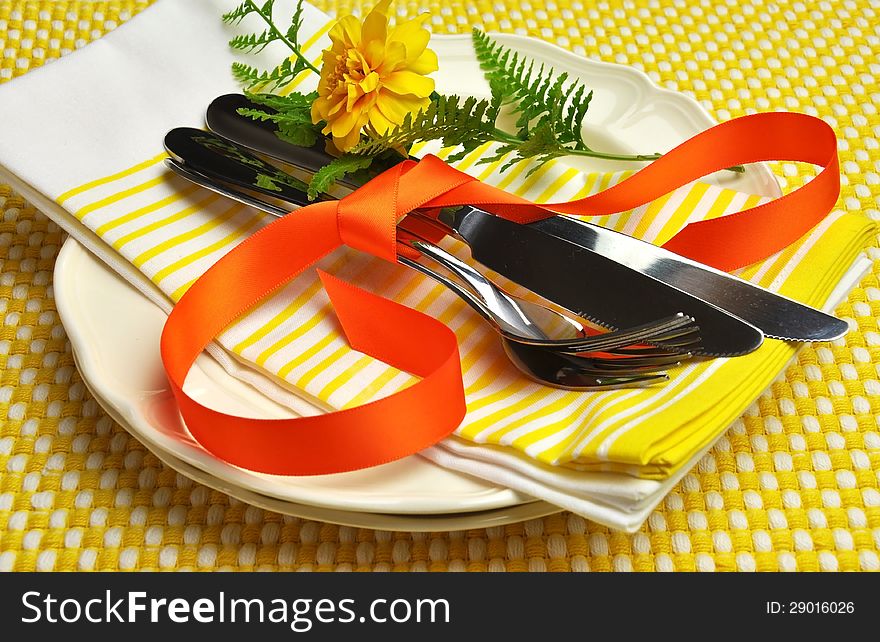 Yellow theme formal dinner table setting.