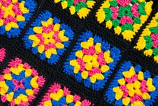 Colorful Cotton Granny Square. Crochet Texture Close Up Photo. Knitted Zigzag Handmade Jewelry Stock Photo