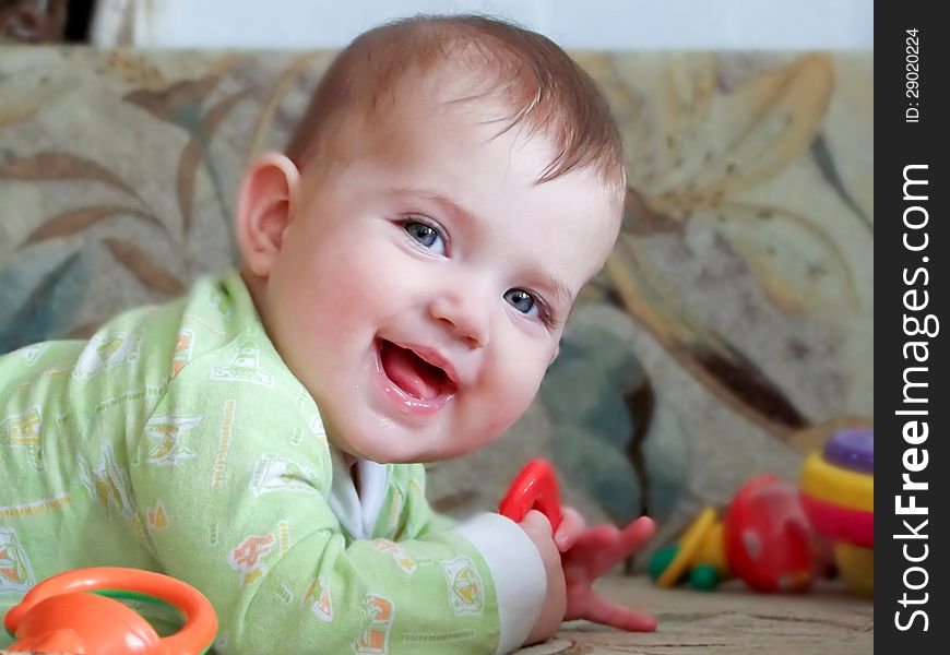 Smile of a Child with a toy in his hand. Smile of a Child with a toy in his hand