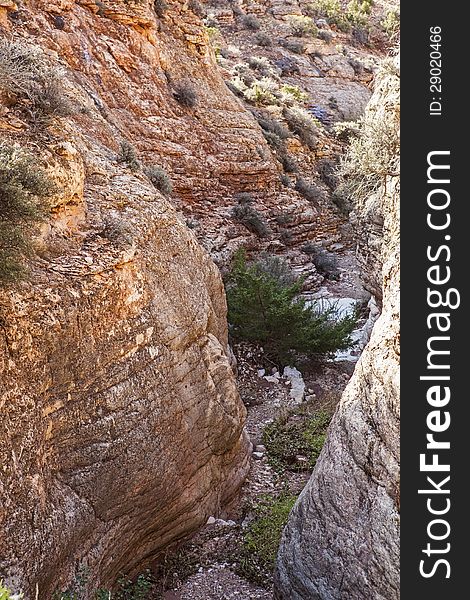 The deep canyon washout is carved through limestone. The deep canyon washout is carved through limestone.