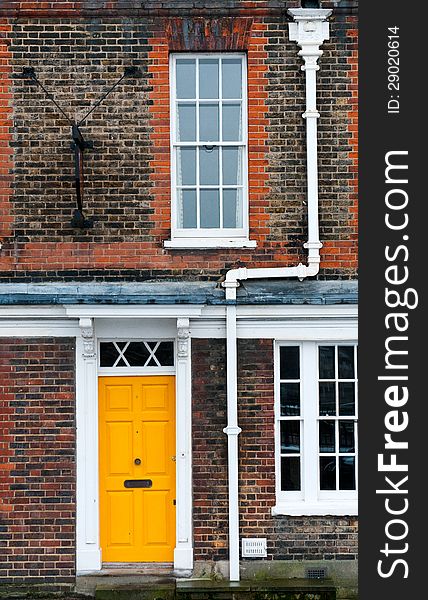 Traditional English house yellow door entrance