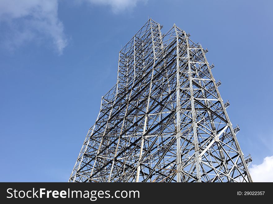 Abstract steel construction with blue sky and clouds. Abstract steel construction with blue sky and clouds