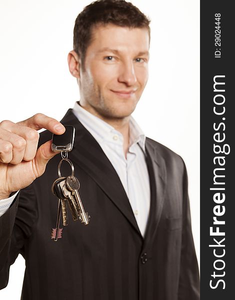 Handsome businessman gives a bunch of keys