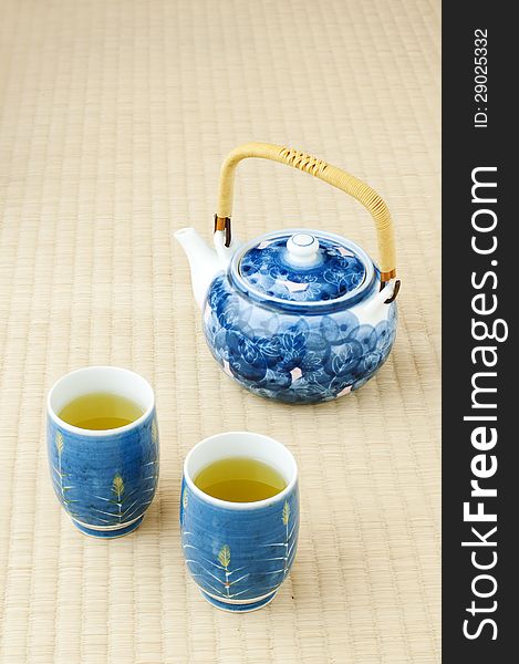 Green tea in a bowl on a tatami floor