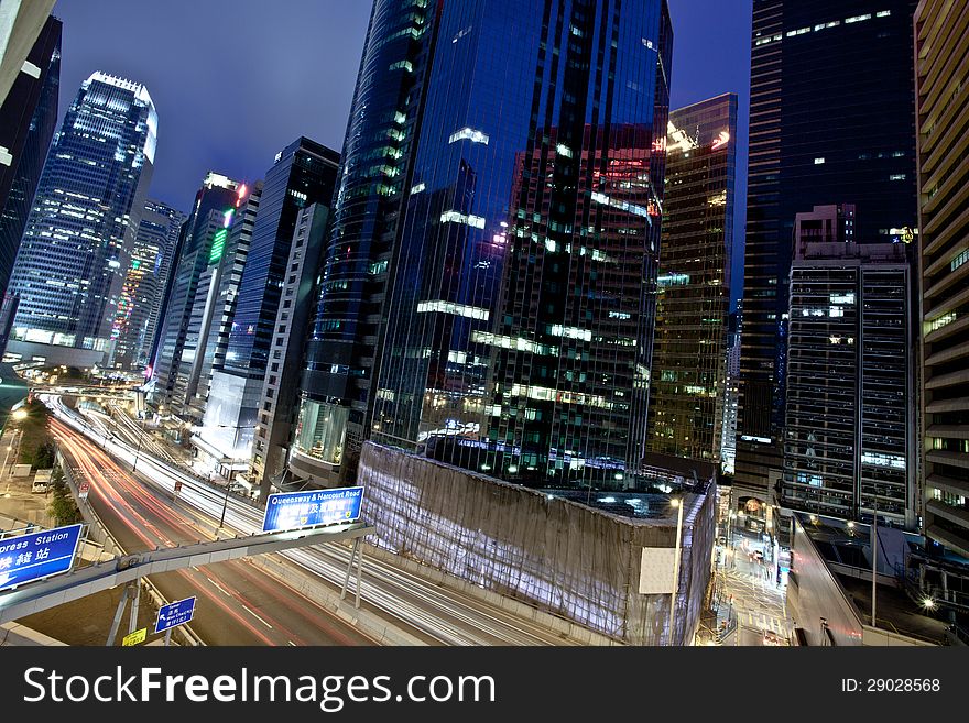 A view of the lights and skyscrapers in downtown Hong Kong at night