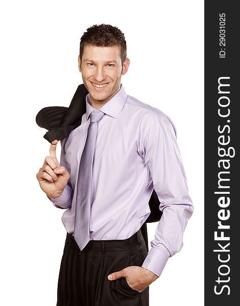 Smiling handsome businessman in a shirt with a jacket over his shoulder standing on white background