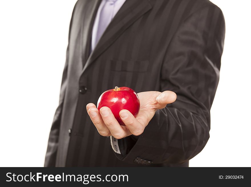 Male hand holding a red apple on white background