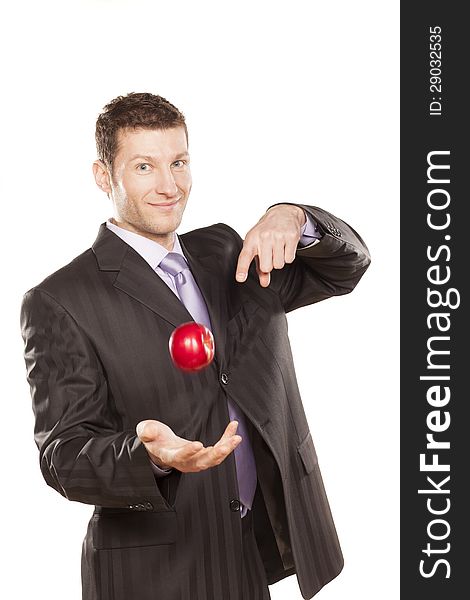 Businessman Tossing Apple on White Background