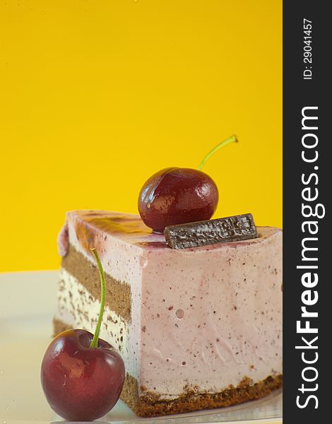 Close-up of a fruit cake on yellow background