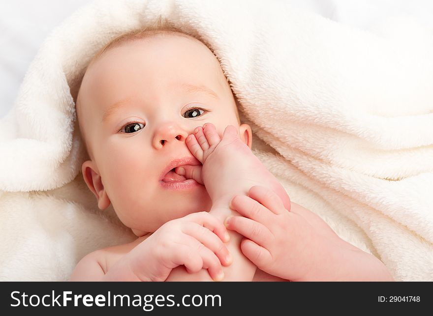 Small Baby Sucking Her Finger On Leg