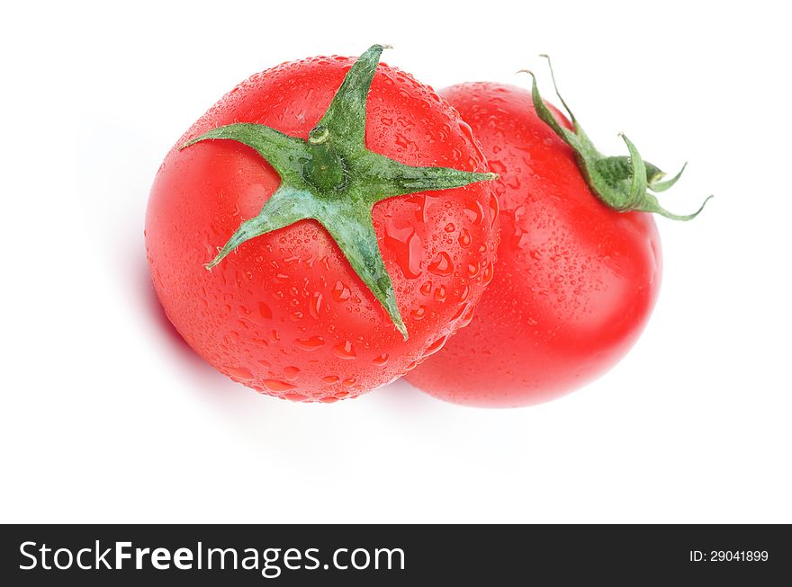 Two Perfect Raw Tomatoes with Stems and Droplets isolated on white background. Two Perfect Raw Tomatoes with Stems and Droplets isolated on white background
