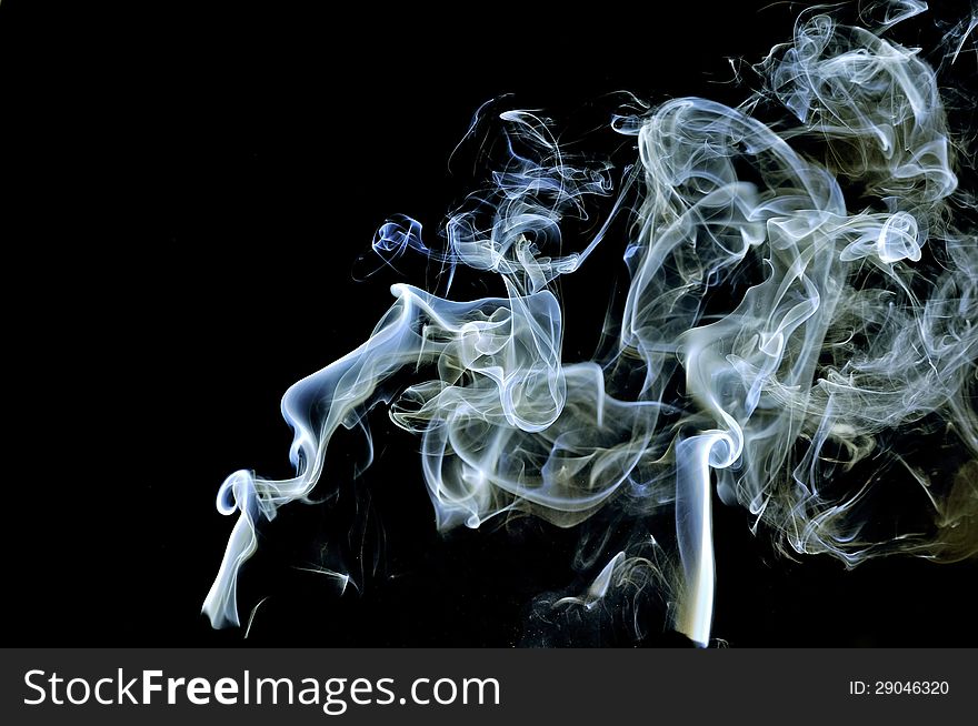 Abstract Smoke On Black Background.