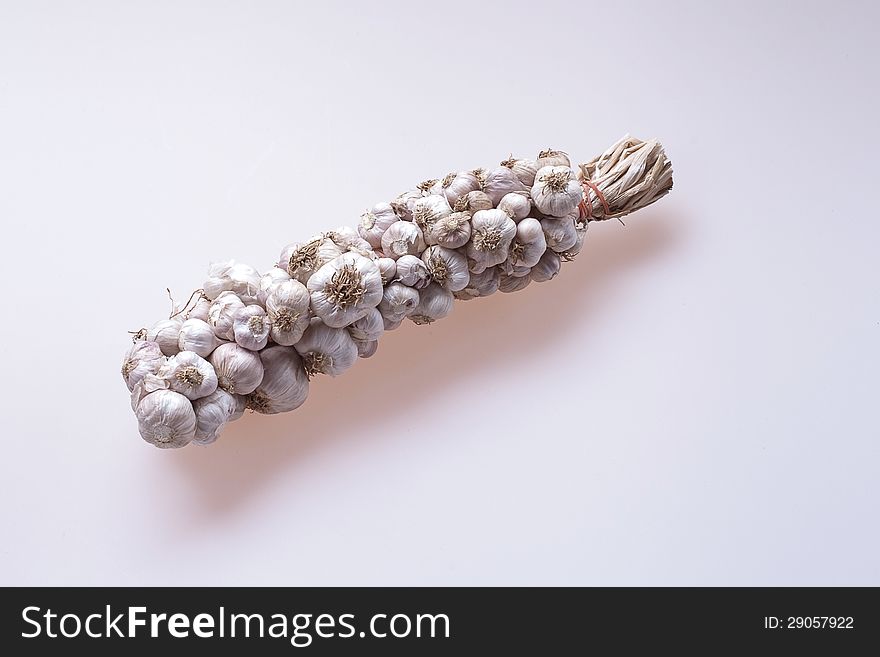 A Braid of garlic bulbs .