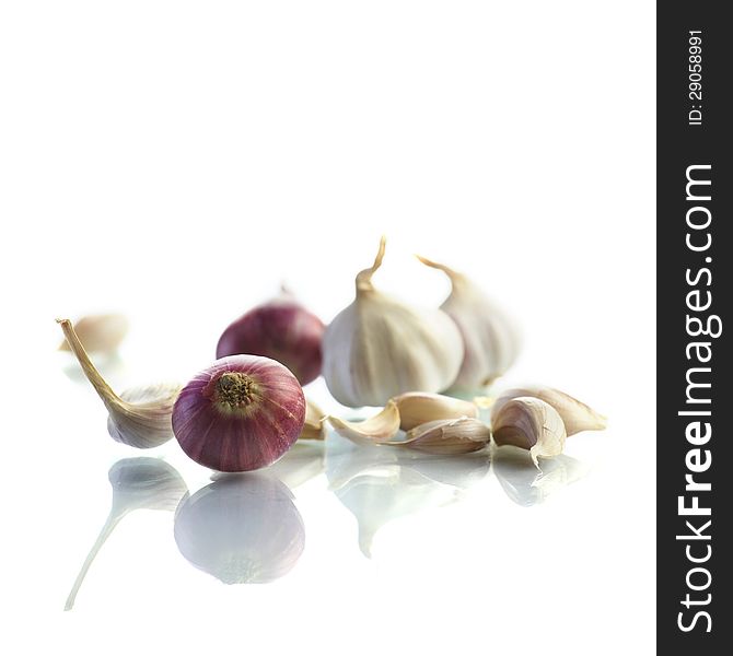 Onions and garlic on white background