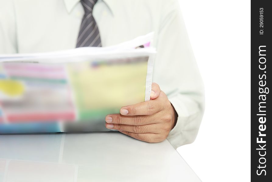 Businessman reading a newspaper On the desk