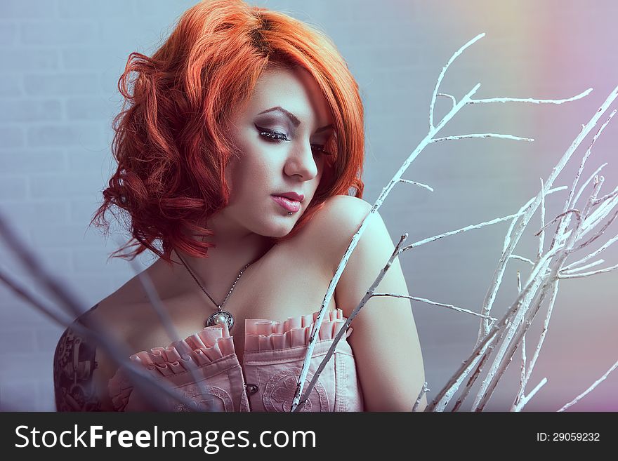 Sensual young women with red hairs posing in studio. Sensual young women with red hairs posing in studio