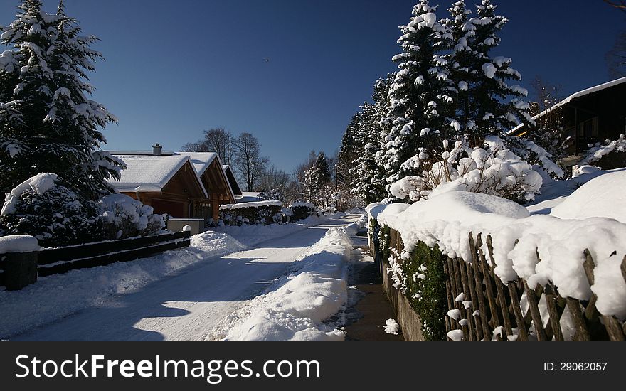 A sunny winter day in a residential neighborhood of the Bavarian village of Uffing on Lake Staffel. A sunny winter day in a residential neighborhood of the Bavarian village of Uffing on Lake Staffel.