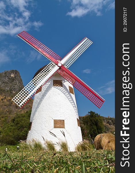 White wind mill with blue sky and cloudy