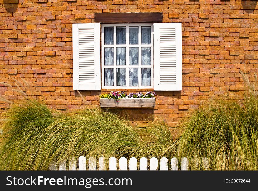 White window with brick wall