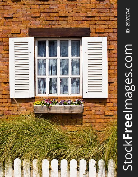 White window with brick wall