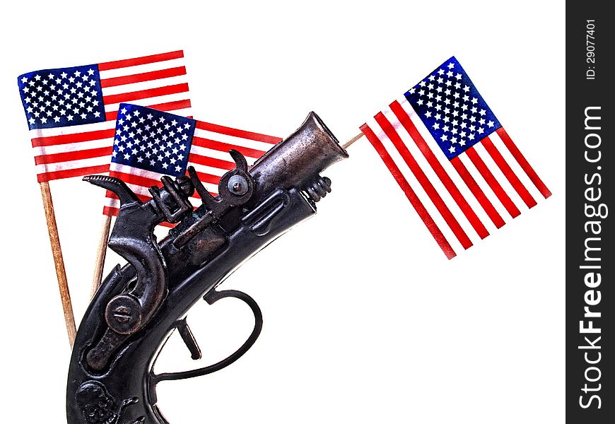 Red white and blue ribbon and antique gun replica. Red white and blue ribbon and antique gun replica.