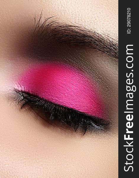 Close-up of fashion eyes make-up, bright pink eyeshadow