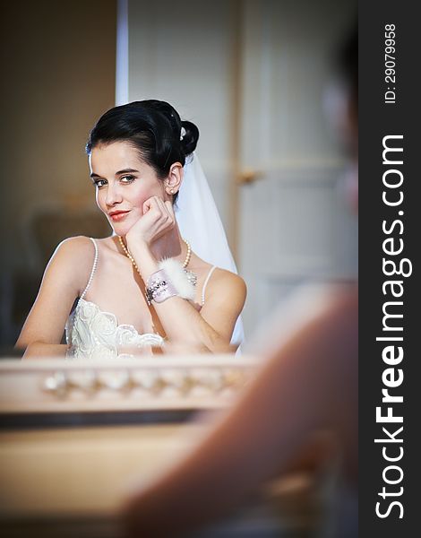 Beautiful Bride Sitting Near Mirror