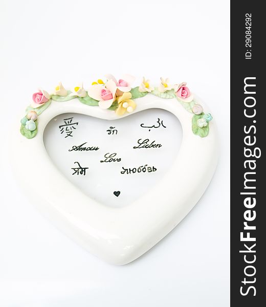 A white ceramic hearth with various language meaning of love on white