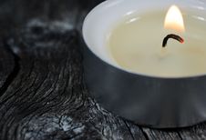 Close-up Photograph Of A Lit Tea Light Candle On An Old Wooden B Royalty Free Stock Images Close-up Photograph Of A Lit Tea Light Candle On An Old Wooden B Royalty Free Stock Images