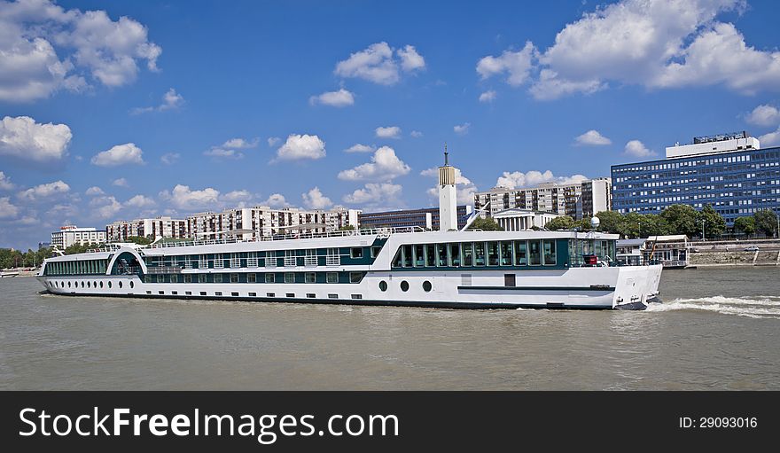 Long ship with passengers on the river of Danube