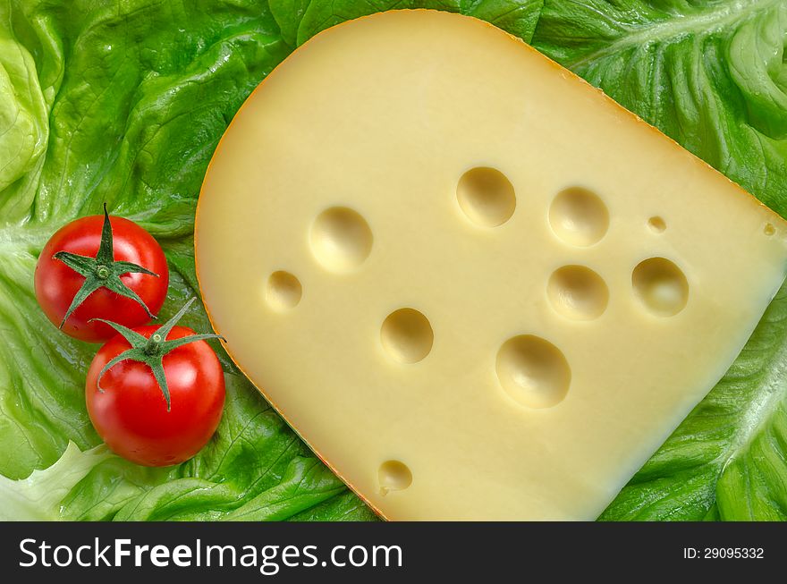 Swiss cheese , tomatoes and green salad. Swiss cheese , tomatoes and green salad