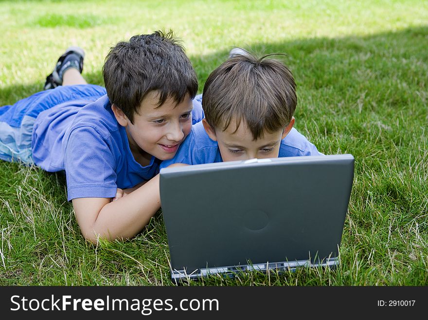 Two Cute Boy Study On Computer