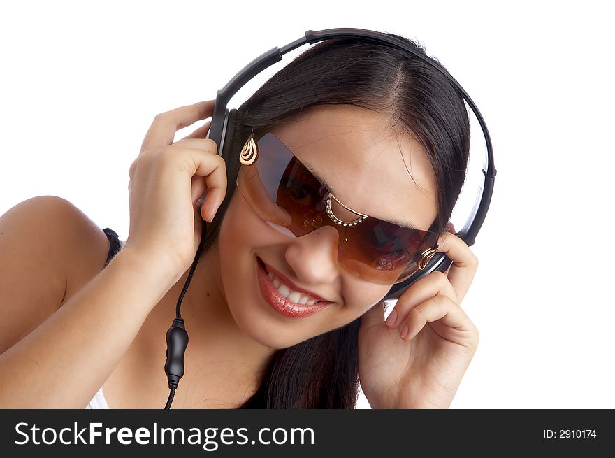 Young beautiful happy women listening music in headphones. Young beautiful happy women listening music in headphones