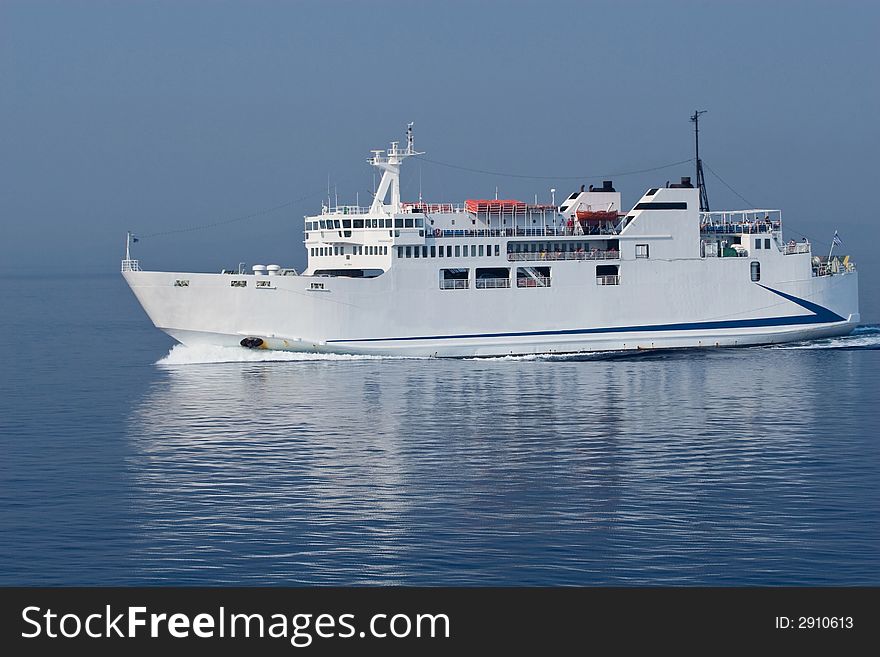 White ferry sailing on blue sea waters