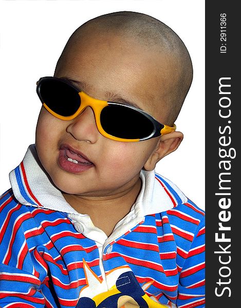 A stylish bald Indian kid happy with his sun glasses