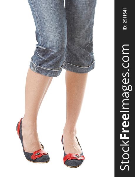 Girl with long beautiful legs in jeans and jeans shoes. Girl with long beautiful legs in jeans and jeans shoes