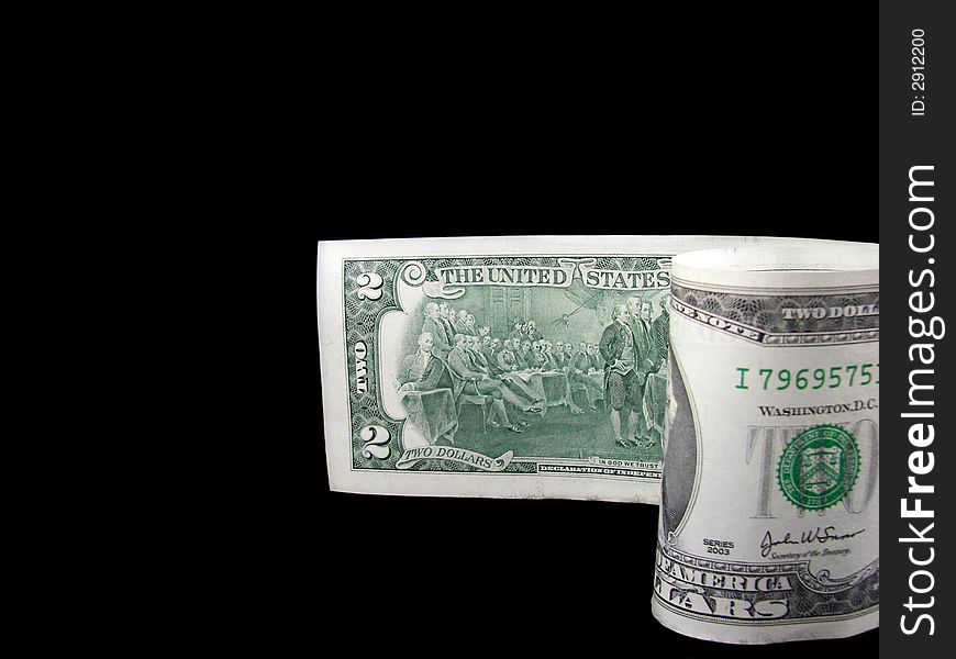 Two dollar bill isolated on black. American currency seldom used.