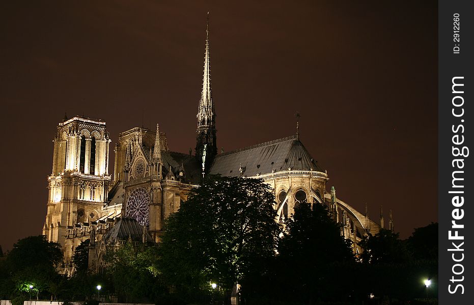 Photograph of the famous cathedral of Notre Dame in Paris, France, by night. Photograph of the famous cathedral of Notre Dame in Paris, France, by night.