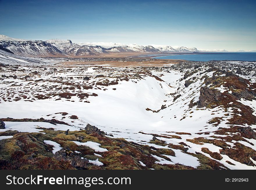 Icelandic landscape with mountains and snow