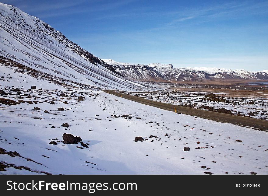 Empty road leading into the wilderness.