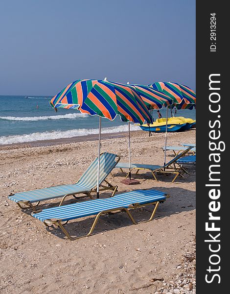 Colorful beach umbrellas at Adriatic Sea - Corfu, Greece. Colorful beach umbrellas at Adriatic Sea - Corfu, Greece
